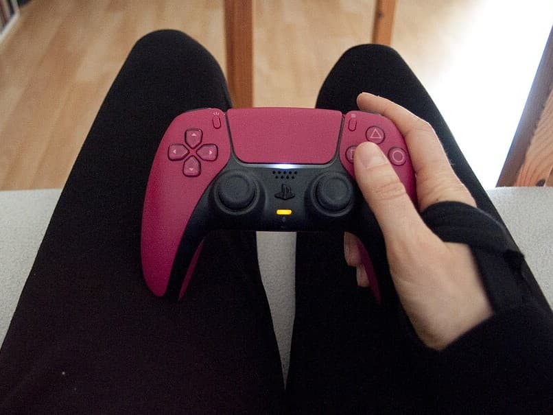 A person holding a game controller, mid-play