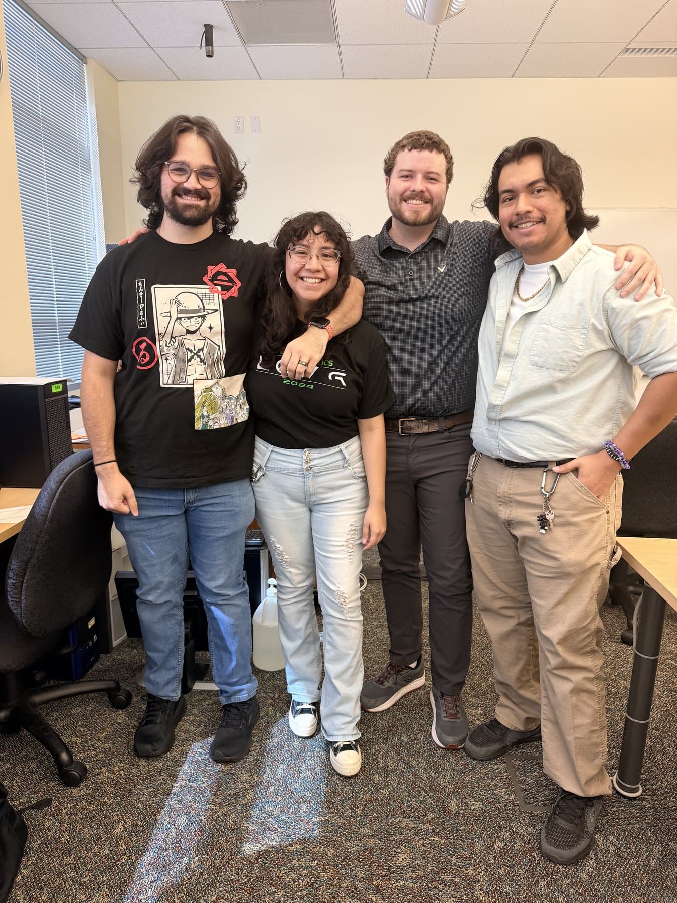 Four We Glue students with their arms around each other